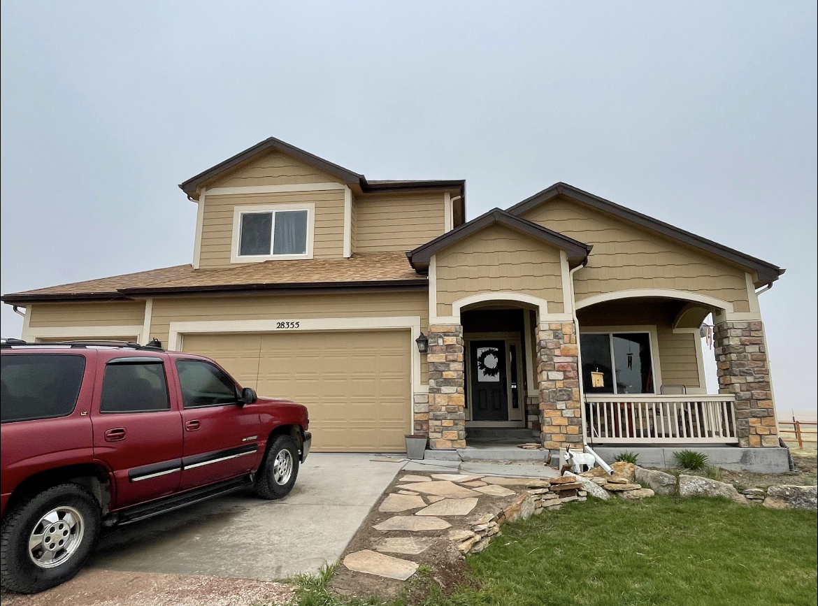 The same Colorado home exterior before repainting