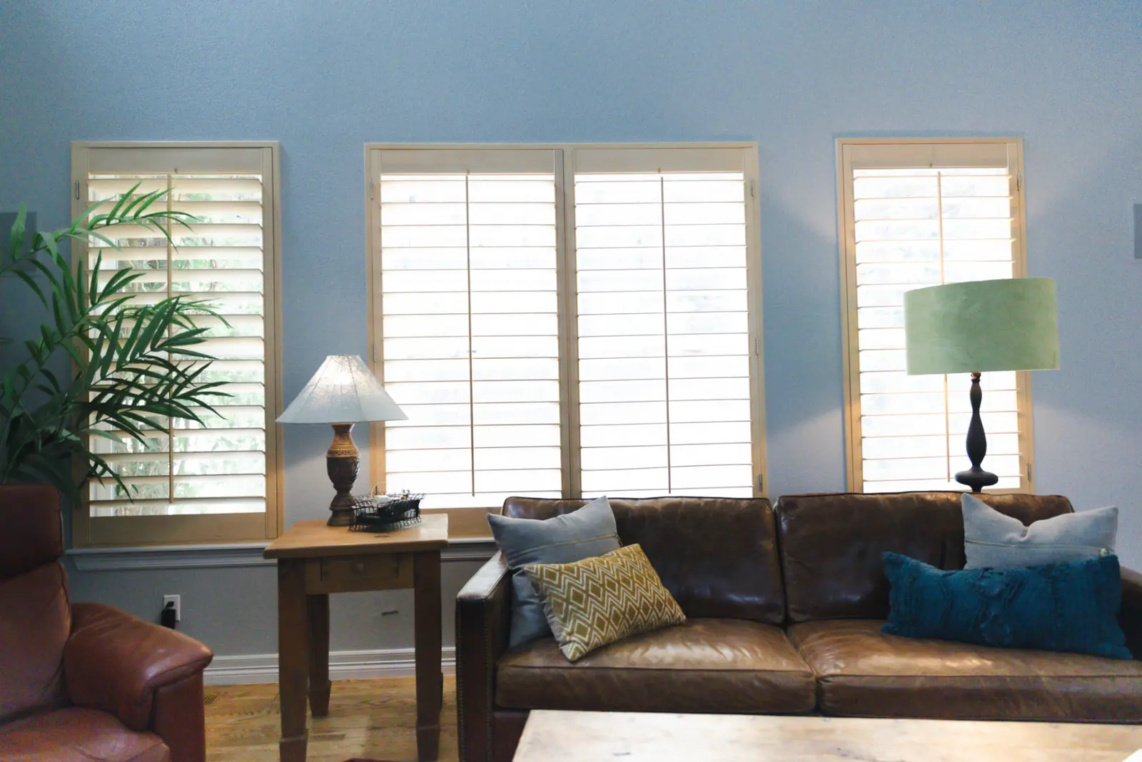 A Denver-area living room finished by Right Touch Painting in soft blue-gray with crisp white trim