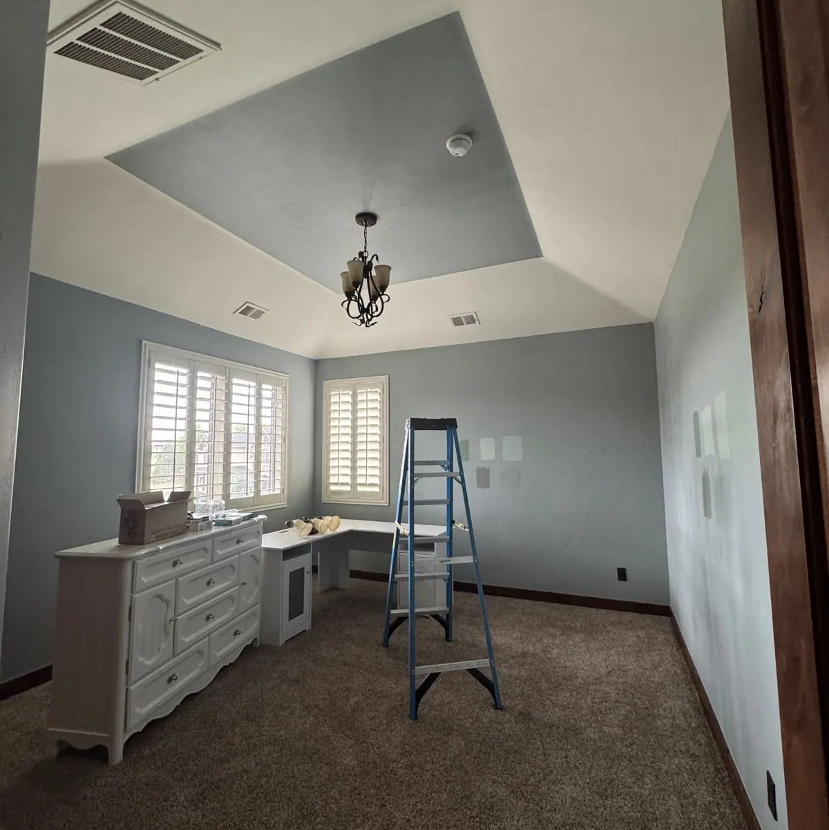 Paint samples brushed on a bedroom wall during a Right Touch Painting color consultation