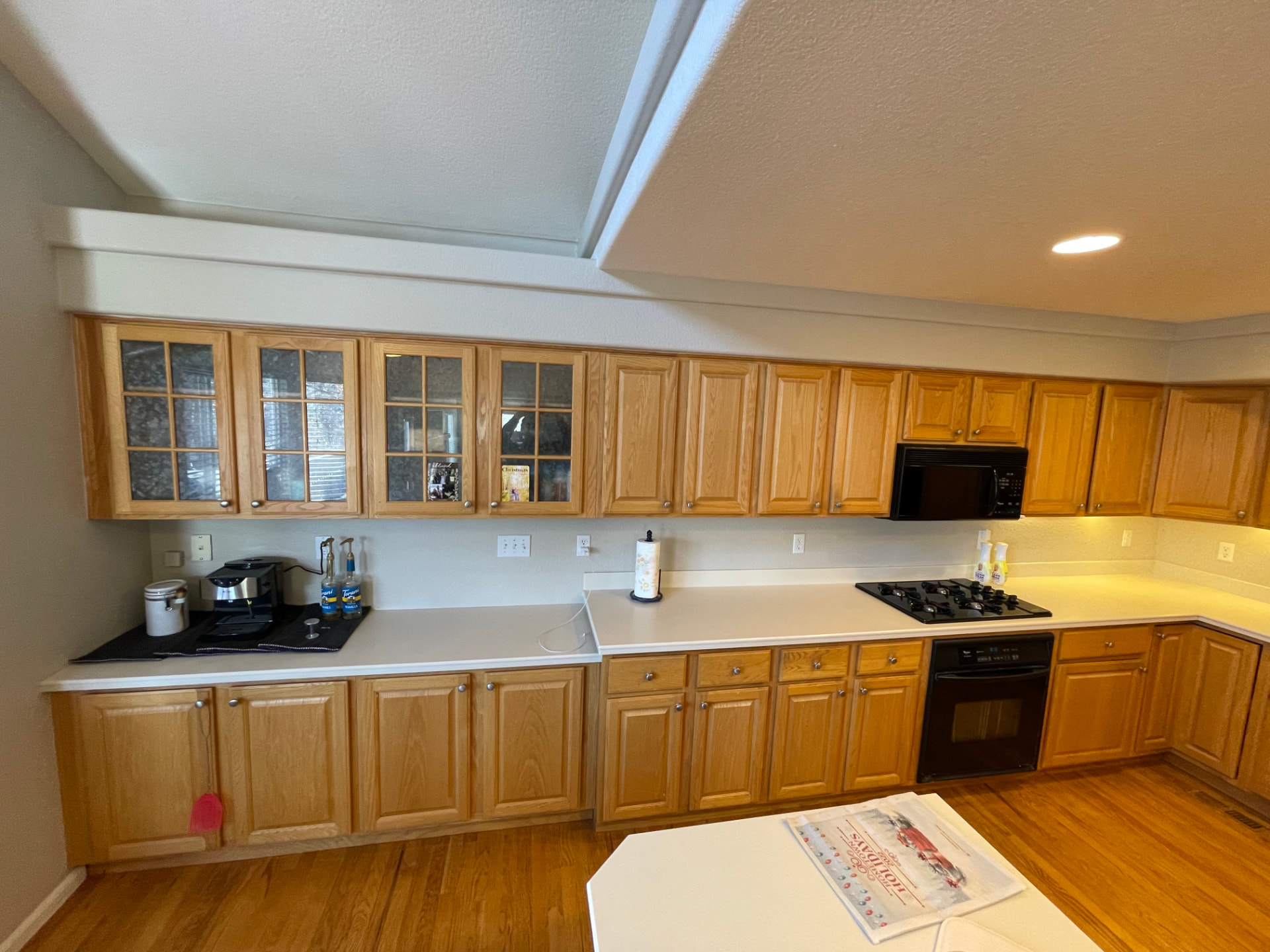 The same kitchen cabinets in original oak before painting
