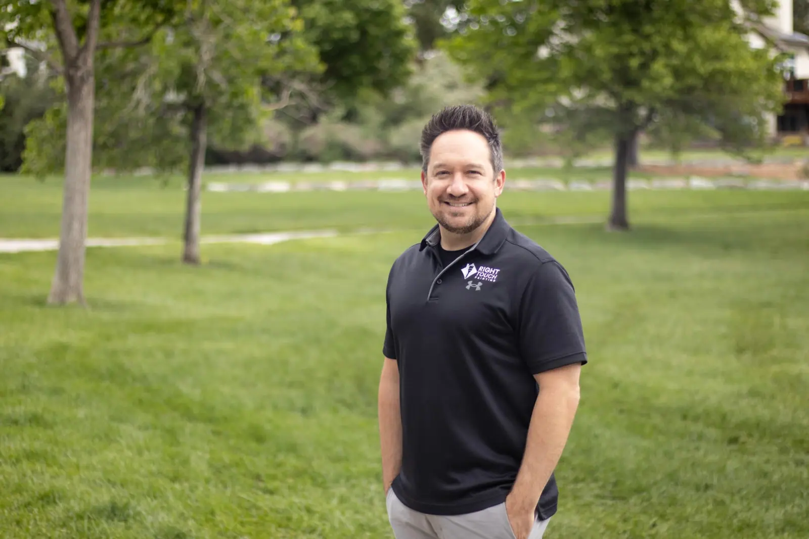 Derek, co-owner of Right Touch Painting, in a company polo